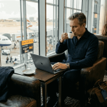 Executive working in luxury airport lounge