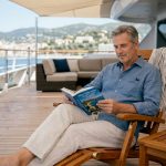 Cruise guest relaxing on luxury ship deck