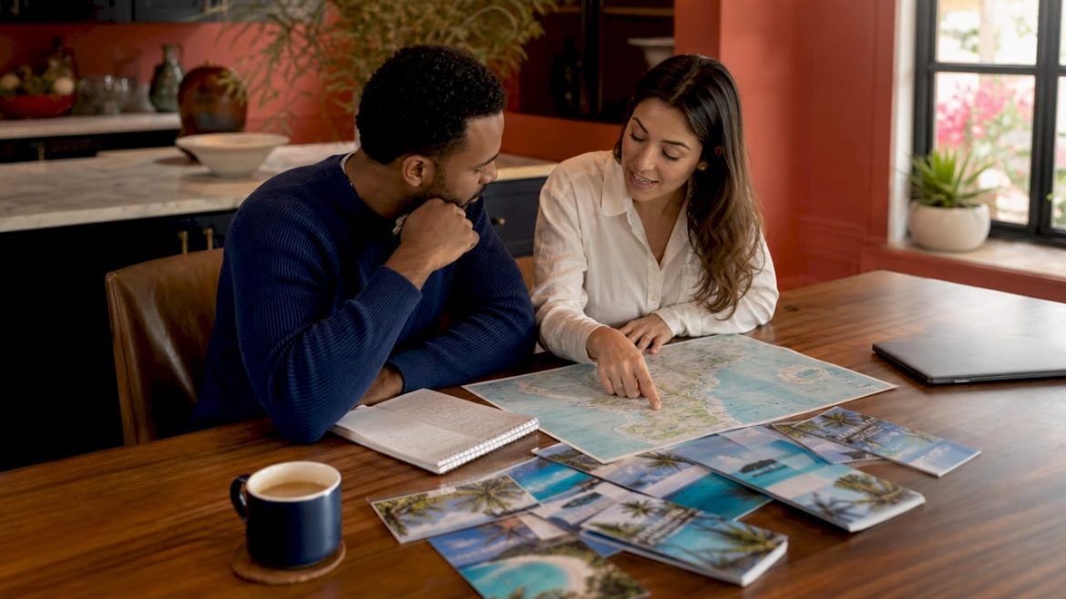 Couple planning honeymoon itinerary together