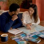 Couple planning honeymoon itinerary together