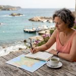 Woman planning Mediterranean cruise itinerary