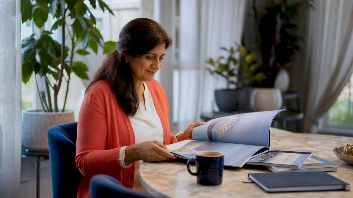 Woman planning concierge cruise at home desk
