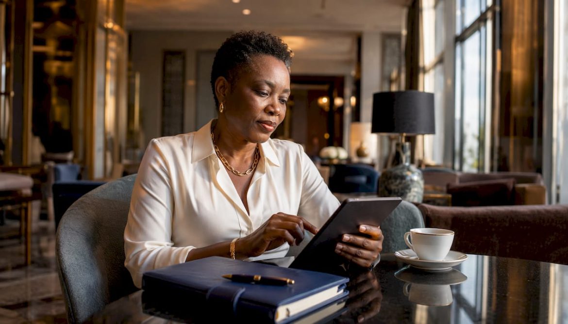 Woman planning luxury group travel on tablet