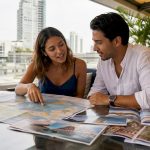Couple planning honeymoon trip over map