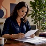 HR manager reviewing employee rewards reports