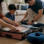 Family packing luggage for travel