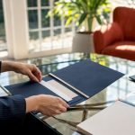 Concierge hands preparing VIP wedding travel plans