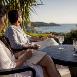 Couple planning honeymoon itinerary outdoors
