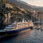 Luxury cruise ship docked in Mediterranean harbor