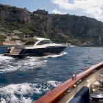 Private boat cruising Amalfi Coast cliffs