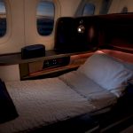Lie-flat business class airplane seat in flat bed mode