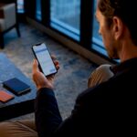 Traveler verifying booking message on phone