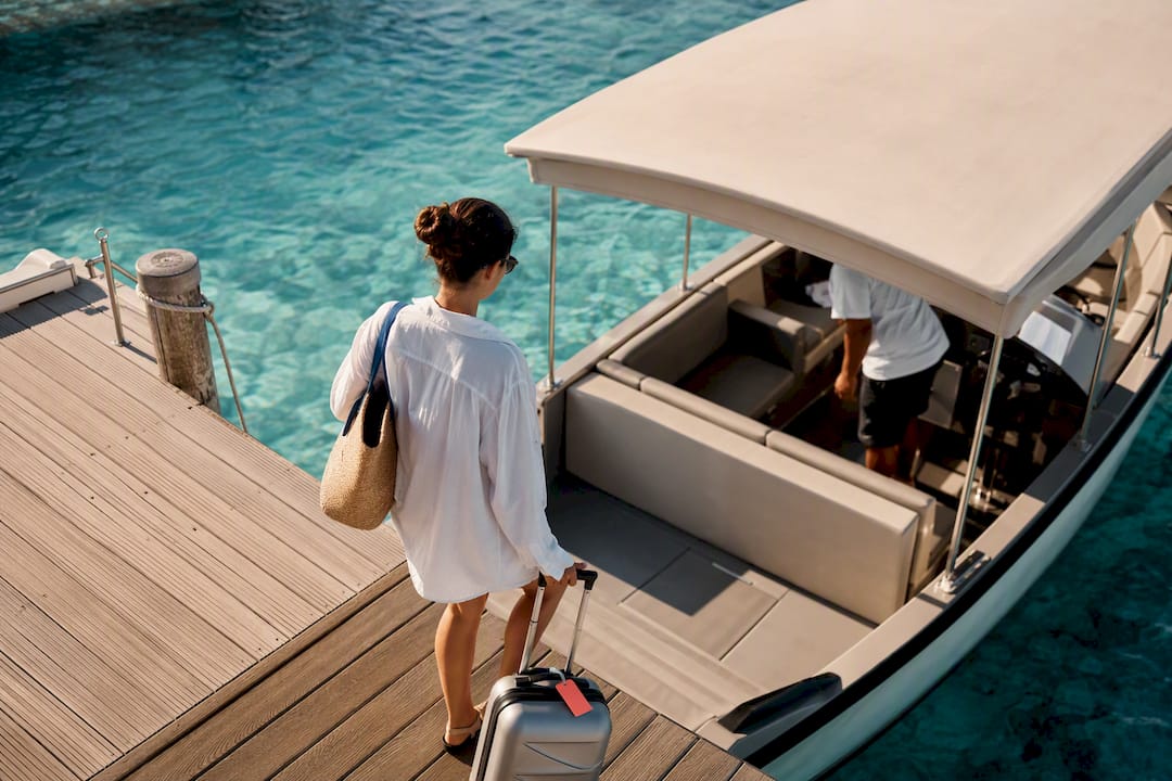 Traveler boarding Tahiti lagoon transfer boat