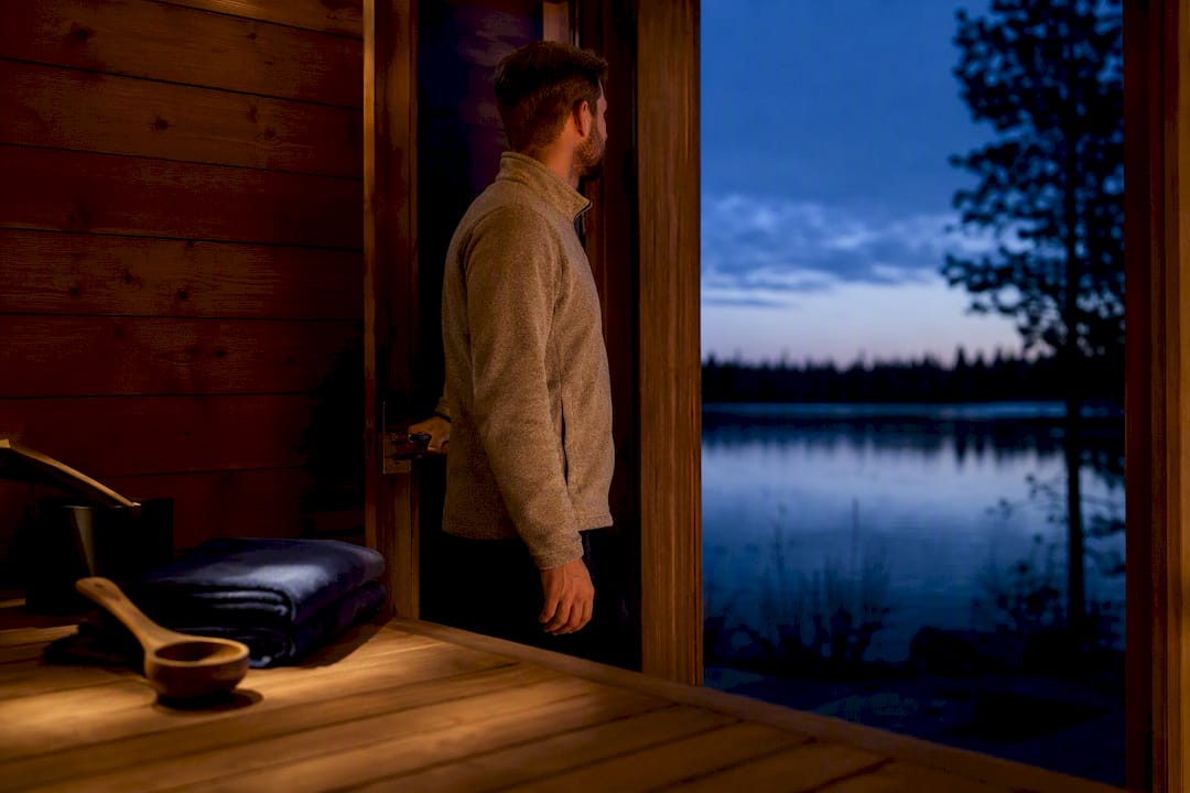 Private Finnish sauna overlooking winter lake