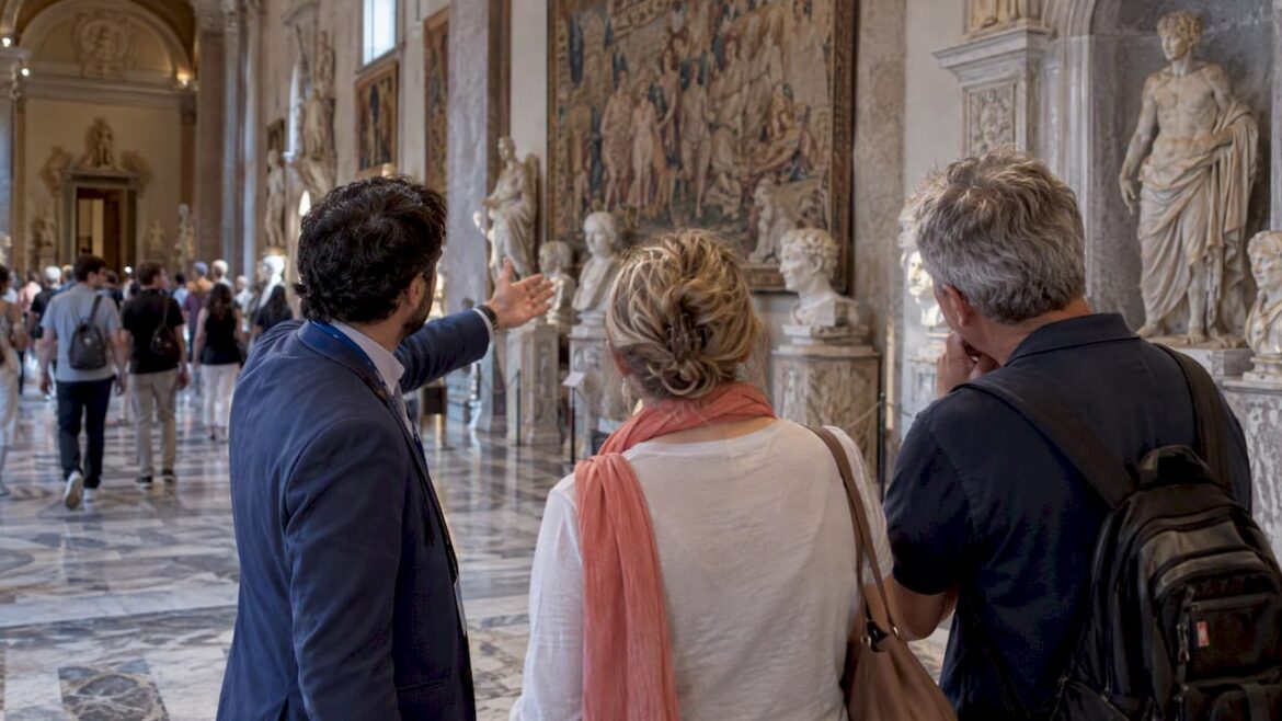 Guide leading a couple through Vatican Museums