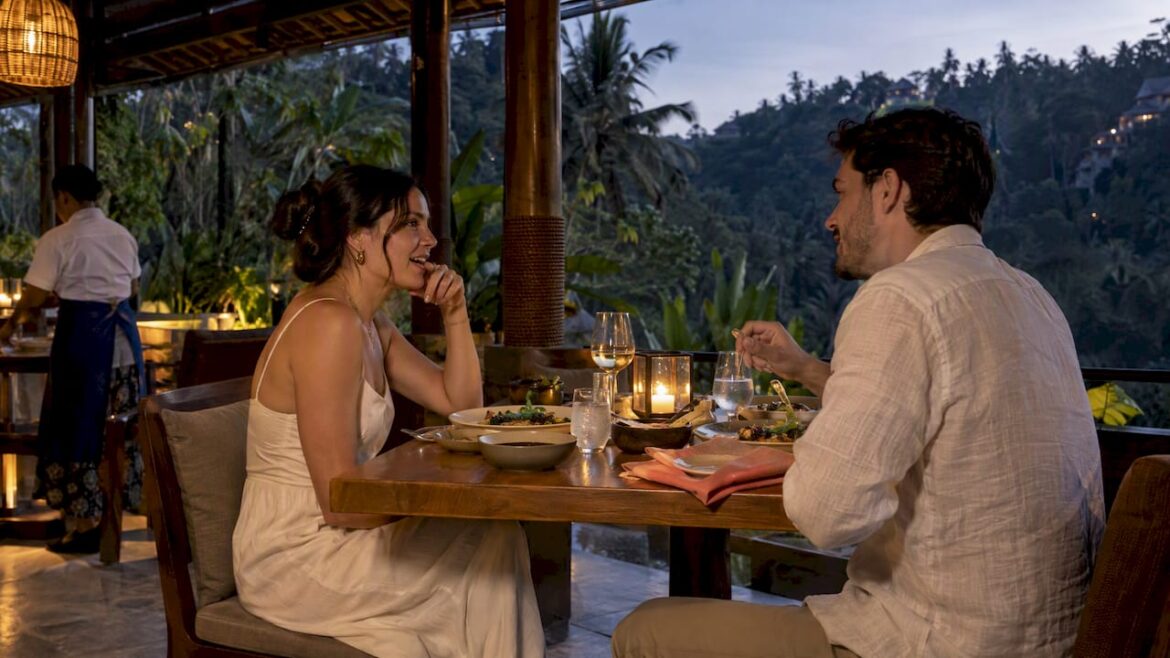 Couple sharing dinner at a Bali pavilion