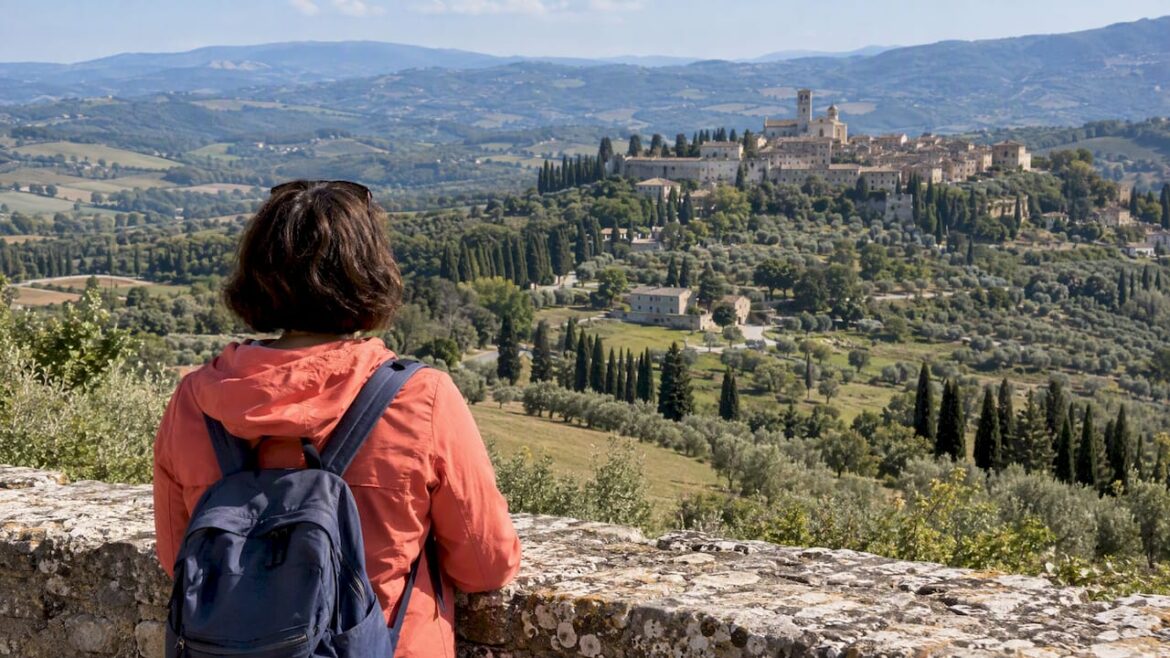 Traveler overlooking central Italian hill country