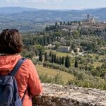 Traveler overlooking central Italian hill country