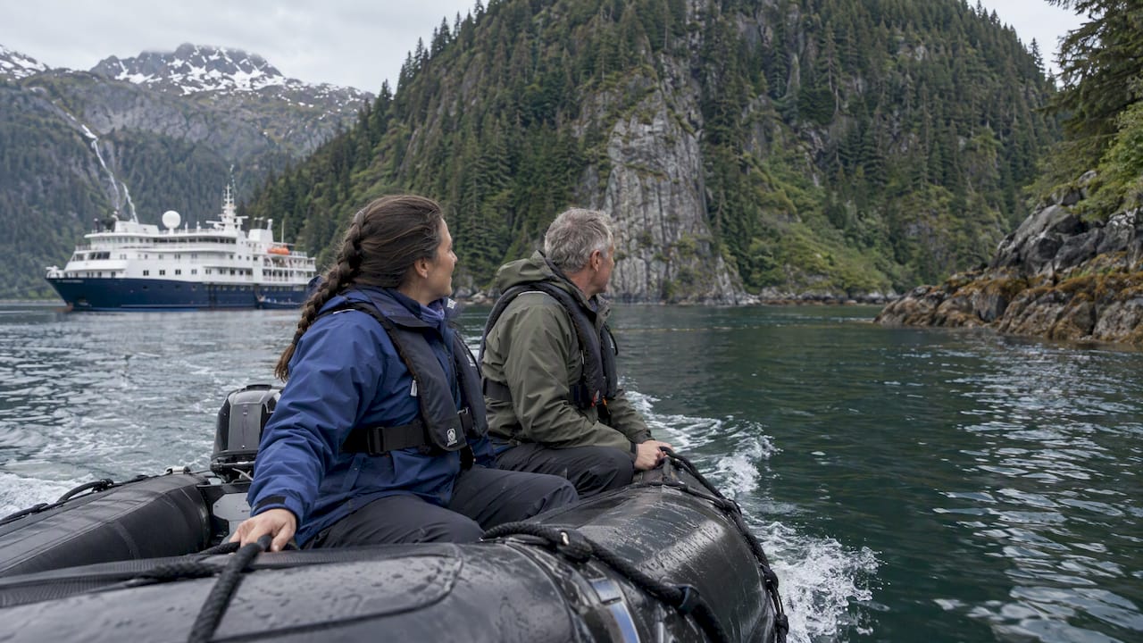 Zodiac exploring a sheltered Alaskan cove