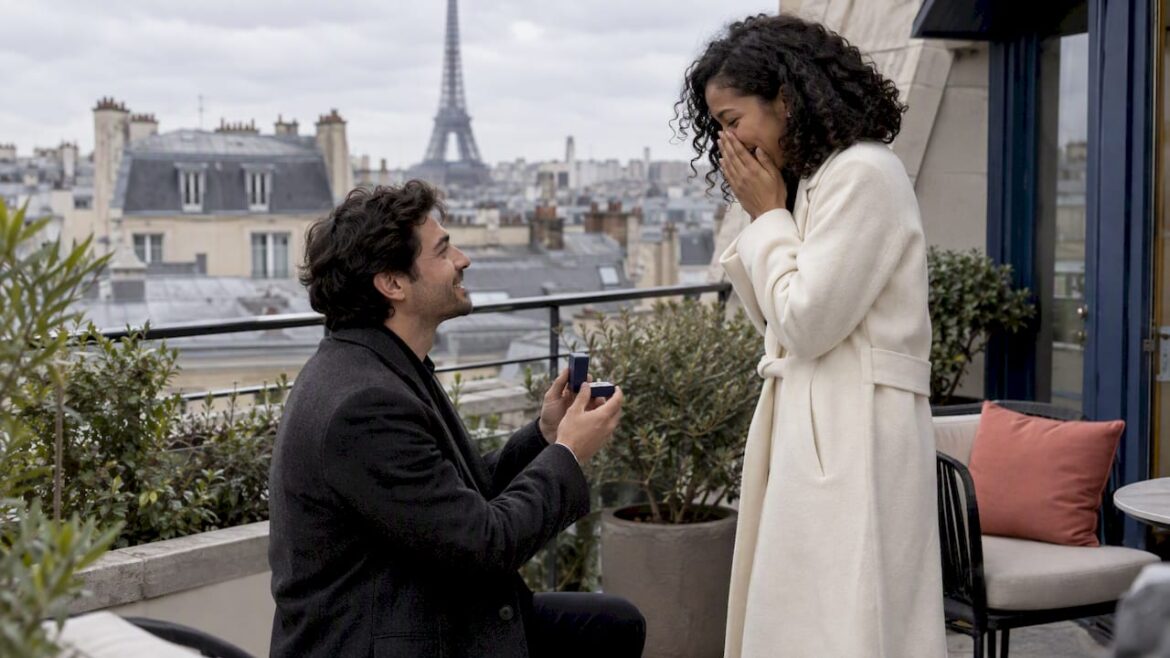 Couple sharing a proposal on a Paris terrace