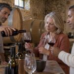 Guests taste wine in a Tuscan cellar