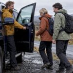 Private guide welcoming guests to an Iceland tour vehicle
