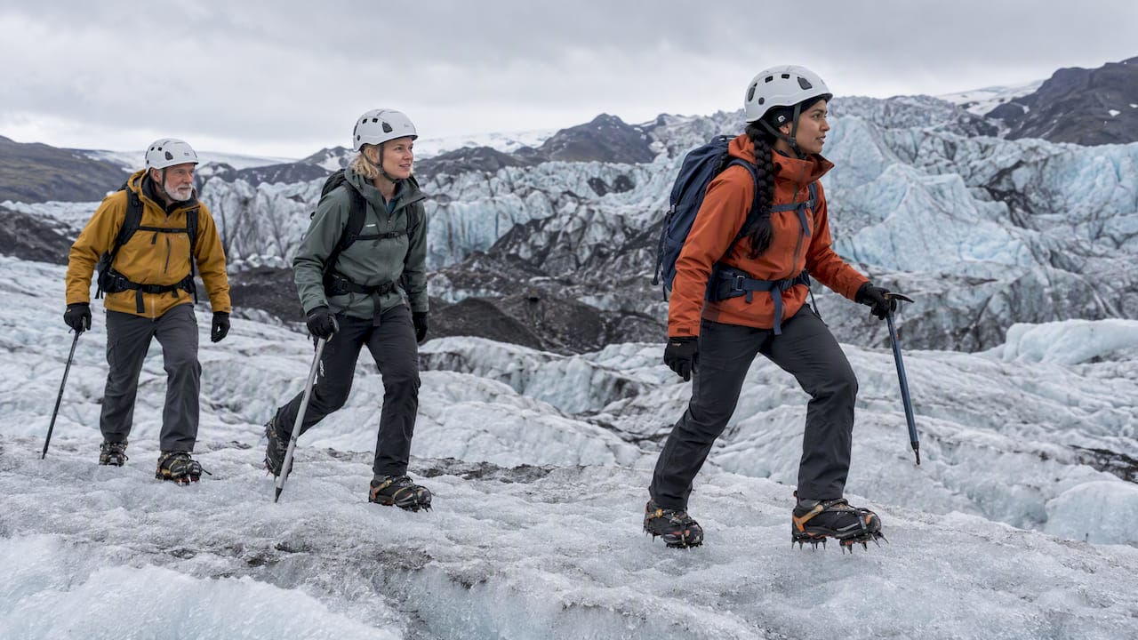 Guide leading guests across an Icelandic glacier
