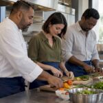 Retreat guests taking part in a chef-led cooking experience
