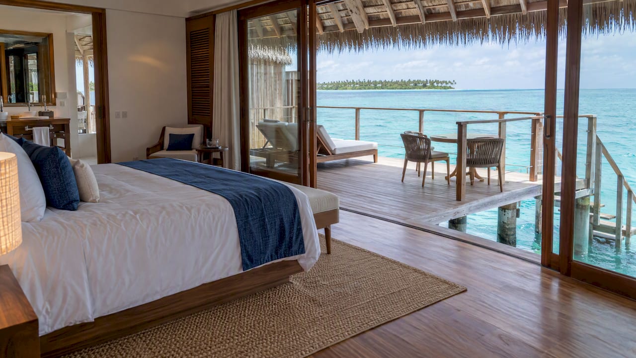 Overwater villa opening onto a private deck